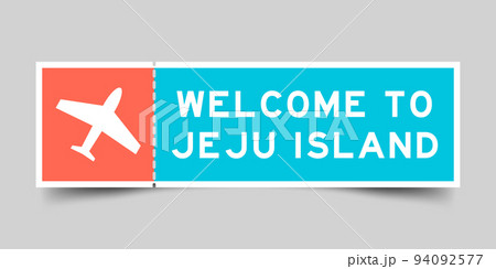 Orange and blue color ticket with plane icon and word welcome to jeju island on gray background 94092577