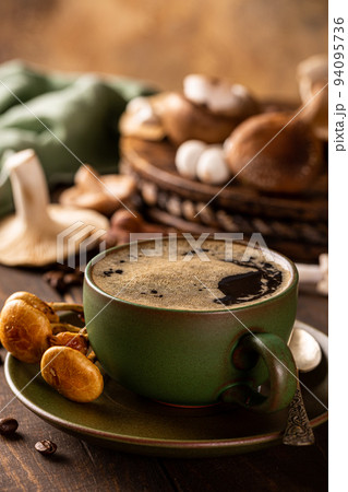 Mushroom coffee in green cup Mushroom coffee in green cup 94095736
