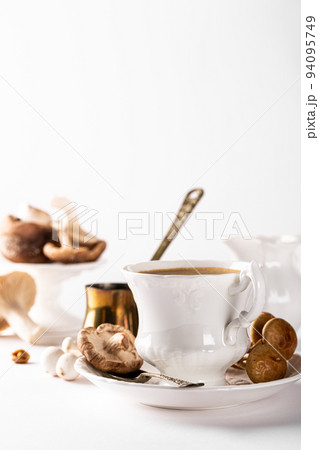 Mushroom coffee in white porcelain vintage cup Mushroom coffee in white porcelain vintage cup 94095749