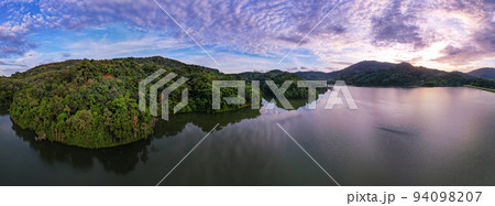 Aerial view drone shot of panorama abundant rainforest Sunset or sunrise sky over lake,Beautiful landscape nature mountains view in phuket thailand Aerial view drone shot of panorama abundant rainforest Sunset or sunrise sky over lake,Beautiful landscape nature mountains view in phuket thailand 94098207