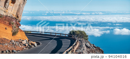 Spectacular high mountain road over the clouds 94104016