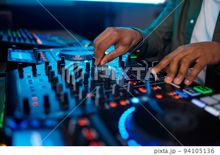 Closeup male hand on sound mixer console 94105136