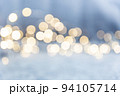 Glowing bokeh wave on a blue background. Christmas light, magic, glitter, celebration. A universal beautiful background with blur in gentle colors. Background for websites, designers. 94105714