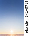 Vertical beautiful landscape, clear blue sky, low horizon, sunrise or sunset. Beauty in nature. Universal natural gradient background. Concept of freedom, tranquility, unity with nature. Copy space. 94105715