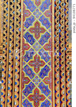 Beautiful detail of traditional Thai art decorated made from ceramic tile and paint, on the wall of building of public Buddhist temple ,textures background. 94106771