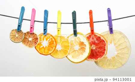 dried pieces of citrus fruits hang on clothespins dried pieces of citrus fruits hang on clothespins 94113001