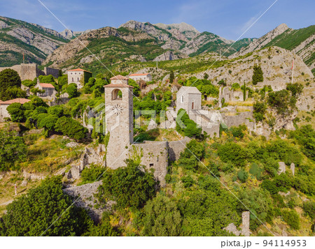 Old city. Sunny view of ruins of citadel in Stari Bar town near Bar city, Montenegro. Drone view Portrait of a disgruntled girl sitting at a cafe table Old city. Sunny view of ruins of citadel in Stari Bar town near Bar city, Montenegro. Drone view Portrait of a disgruntled girl sitting at a cafe table 94114953