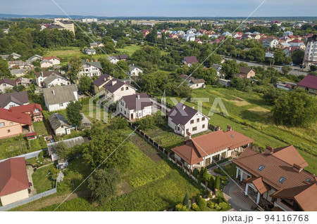 Aerial view of a residential area in a town with private houses. 94116768