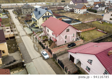 Aerial top view of suburb area with nice houses and cars on sunny day. 94116785