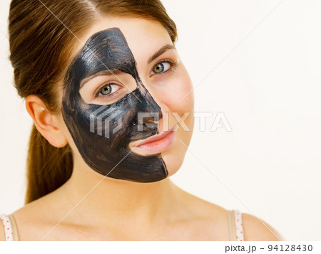 Woman with charcoal facial mask Woman with charcoal facial mask 94128430