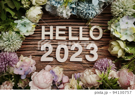 Hello 2023 alphabet letters decorate with flowers on wooden background Hello 2023 alphabet letters decorate with flowers on wooden background 94130757