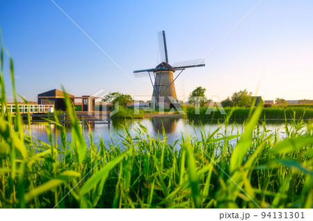 Kinderdijk National Park in the Netherlands. Windmills at the day time.  94131301