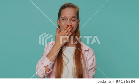 Frightened girl kid closing her mouth with hand refusing to tell terrible secret, unbelievable truth Frightened girl kid closing her mouth with hand refusing to tell terrible secret, unbelievable truth 94136884