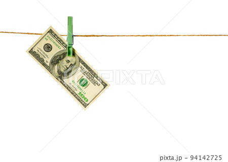 Money laundering. Dollar banknotes hanging on clothesline isolated on white background Money laundering. Dollar banknotes hanging on clothesline isolated on white background 94142725