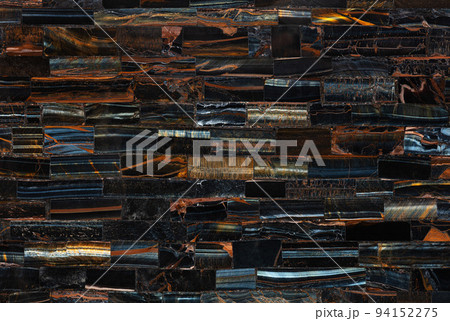 Tiger Eye Blue slab. Polished semiprecious stone for ceramic wall and floor digital tiles. Exclusive luxury gemstone background. Material for unique interior, exterior design decoration. 94152275