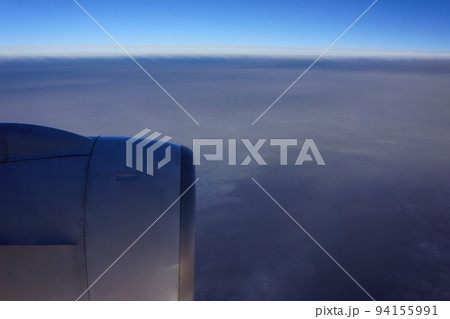 jet plane window sky view with machine wing in the morning. 94155991