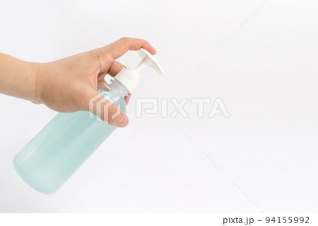 Asian mand hand holds a gel alcohol pump bottle and ready to pushes on it. It's an isolated object on the white clear screen in studio light. Asian mand hand holds a gel alcohol pump bottle and ready to pushes on it. It's an isolated object on the white clear screen in studio light. 94155992