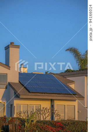 House with solar panels on roof at Del Mar Southern California against blue sky House with solar panels on roof at Del Mar Southern California against blue sky 94166014