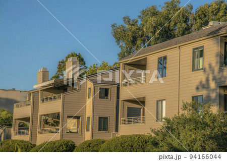 Facade of houses in Del Mar Southern California neighborhood on a sunny day 94166044