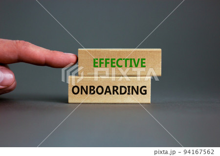 Effective onboarding symbol. Wooden blocks with words Effective onboarding on beautiful grey background. Businessman hand. Business, HR and effective onboarding concept. Copy space. 94167562