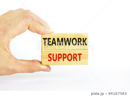 Teamwork support symbol. Concept words Teamwork support on wooden blocks on a beautiful white table white background. Businessman hand. Business and teamwork support concept. Copy space. 94167563