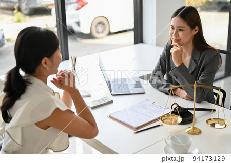 A professional young Asian female lawyer gives her female client advice and counseling A professional young Asian female lawyer gives her female client advice and counseling 94173129