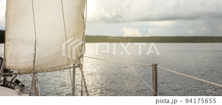 sail of a yacht sailing on the lake 94175655