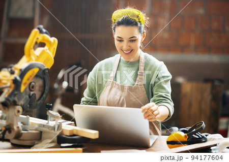 woman carpenter in workshop woman carpenter in workshop 94177604