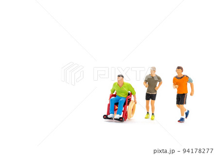 Miniature people Disabled happy friends having fun together Miniature people Disabled happy friends having fun together 94178277