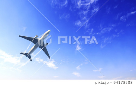 Horizontal nature background with aircraft and Jet trailing smoke in the sky. Airplane and condensation trail 94178508