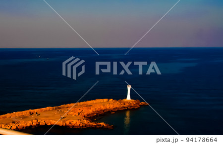 Aerial view to Girne marina , pier and lighthouse like a hand wi Aerial view to Girne marina , pier and lighthouse like a hand wi 94178664
