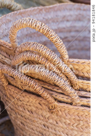 Stack of handmade wicker baskets close up Stack of handmade wicker baskets close up 94181846