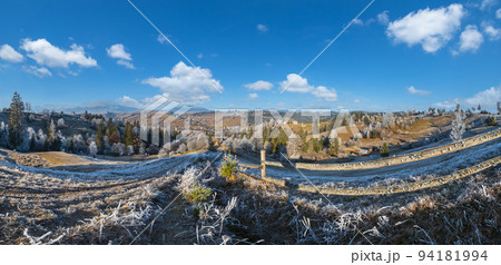 Winter coming. Last days of autumn, morning in mountain countryside peaceful picturesque hoarfrosted scene. Dirty road from hills to the village. Ukraine, Carpathian mountains. Winter coming. Last days of autumn, morning in mountain countryside peaceful picturesque hoarfrosted scene. Dirty road from hills to the village. Ukraine, Carpathian mountains. 94181994