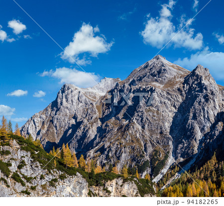 Autumn Alps rocky mountain tops view from hiking path, Kleinarl, Land Salzburg, Austria. Autumn Alps rocky mountain tops view from hiking path, Kleinarl, Land Salzburg, Austria. 94182265