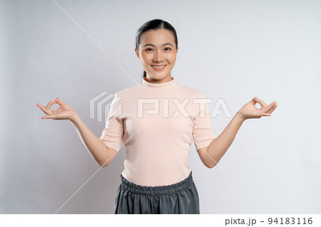 Woman meditating holding her hands in yoga gesture. Woman meditating holding her hands in yoga gesture. 94183116