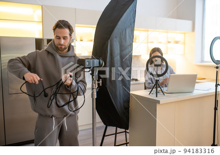 Operator and a video blogger preparing for shooting a vlog 94183316