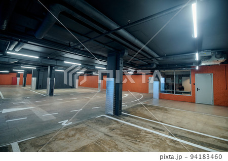 Well-lit parking lot with the safety guard room 94183460