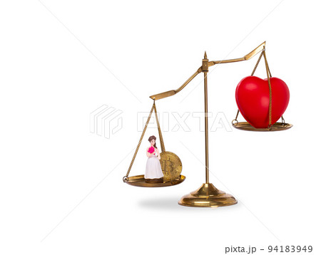 Love Money Symbol Concept. Red Heart shape on balance scale exchange trade for Materialism, bride, bitcoin and buy sale lover. Love for money on balance scale isolated on white background 94183949