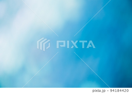 Blur light flare. Bokeh glow. Sky clouds rays. Defocused blue white color gradient beam texture decorative abstract empty space background. Blur light flare. Bokeh glow. Sky clouds rays. Defocused blue white color gradient beam texture decorative abstract empty space background. 94184420