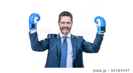 successful man in suit and boxing gloves celebrate success isolated on white, corporate battle. 94184447