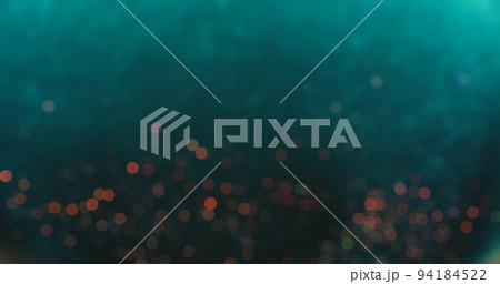 Bokeh light overlay. Blur circles texture. Glowing sparkles. Defocused verdigris green blue red color round particles on dark abstract background. 94184522