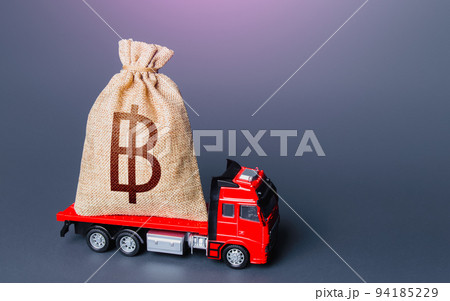 Truck with a thai baht money bag. High super income. Loan or deposit. Financial aid, investments and subsidies. Compensation. Payment of taxes. Debt. Cash collection. Money transfers and transactions. Truck with a thai baht money bag. High super income. Loan or deposit. Financial aid, investments and subsidies. Compensation. Payment of taxes. Debt. Cash collection. Money transfers and transactions. 94185229