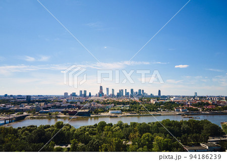 Warsaw aerial view over river and downtown skyline with skyscrapers, Panoramic cityscape of Warshawa city at summer day Warsaw aerial view over river and downtown skyline with skyscrapers, Panoramic cityscape of Warshawa city at summer day 94186239