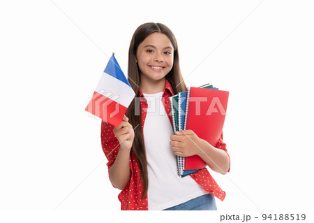 happy teen girl hold french flag and school copybook for studying, education abroad. 94188519