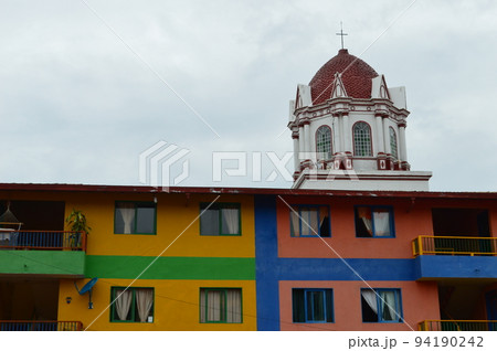 typically colourful buildings facade in Guatape, Colombia. cityscape typically colourful buildings facade in Guatape, Colombia. cityscape 94190242