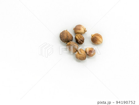 Close-up and top view image of dried Cardamon on white background, a small group of dried Cardamon. Close-up and top view image of dried Cardamon on white background, a small group of dried Cardamon. 94190752