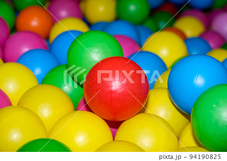 Colorful balls in the pool with balls in the playroom. 94190825