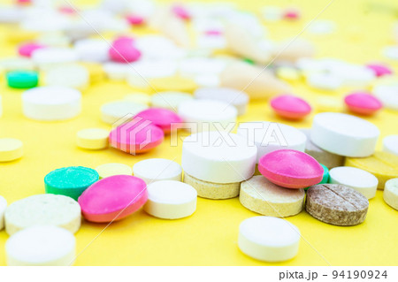 pills on a yellow background 94190924