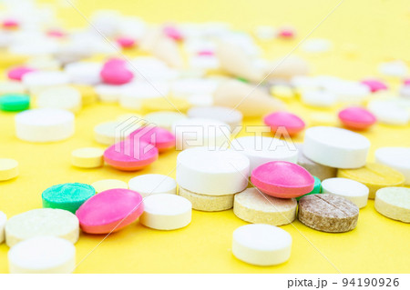 pills on a yellow background 94190926