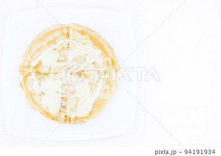 Pancakes drenched with condensed milk 94191934